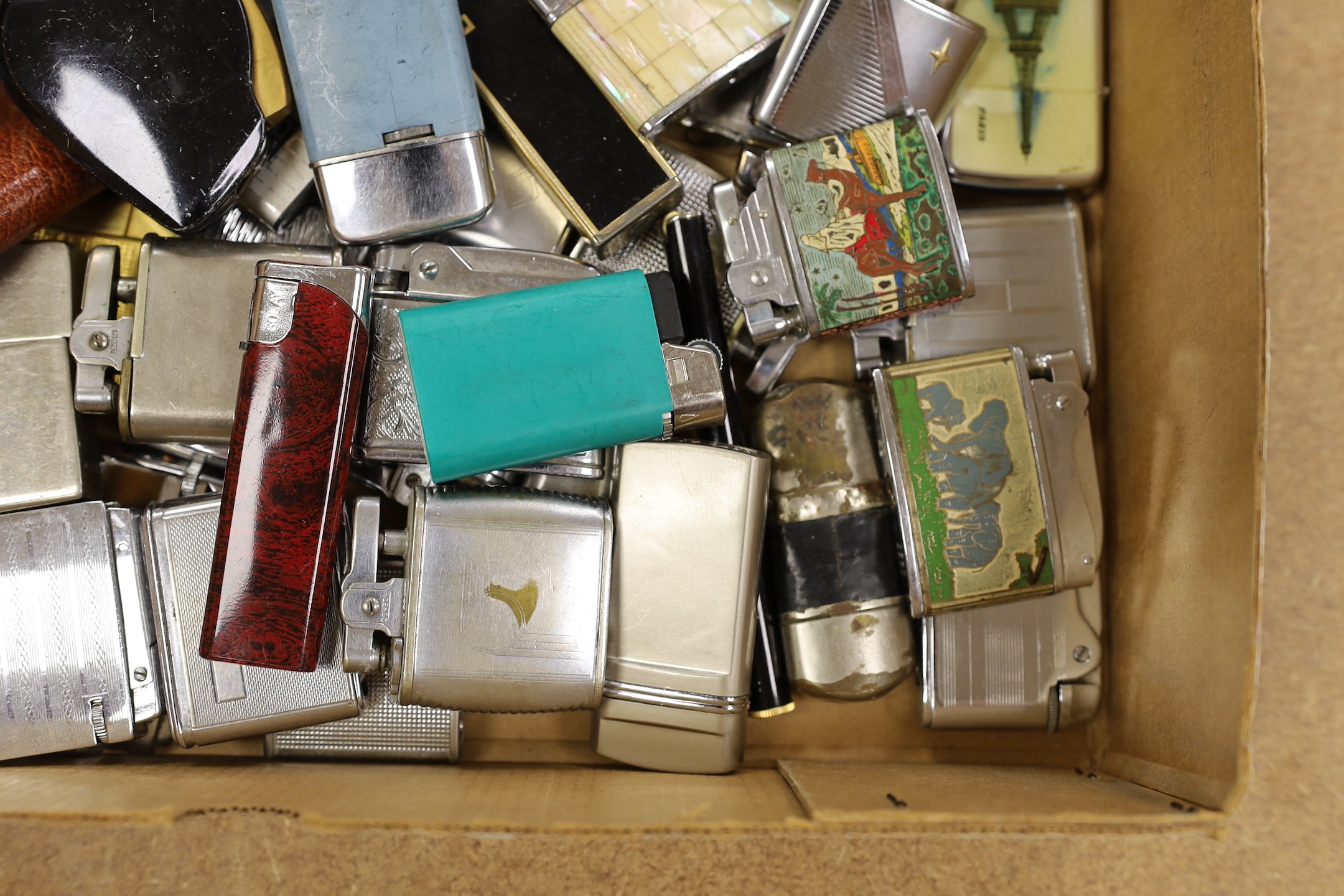 A large collection of lighters and novelty lighters